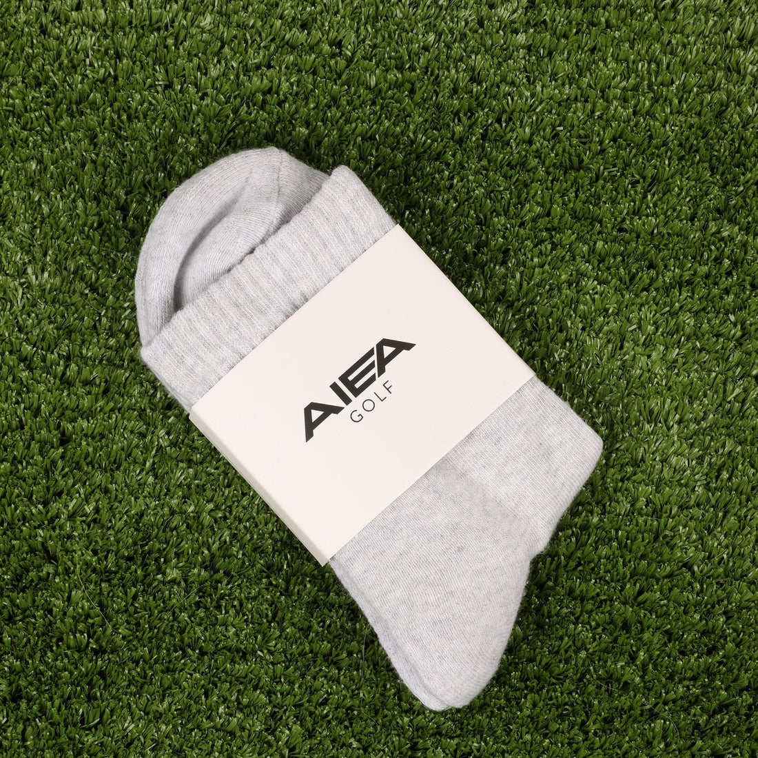 AIEA Golf crew logo socks in heather gray with yellow logo detail