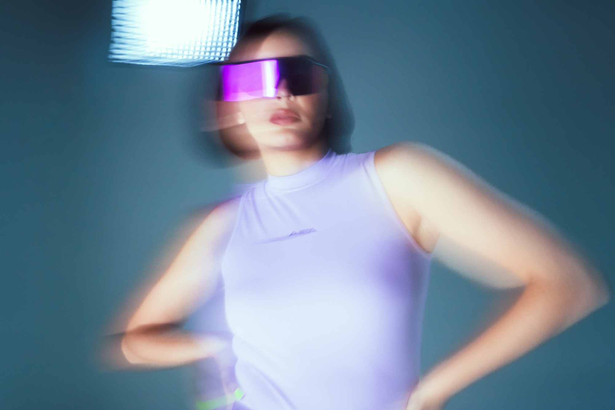 Motion-blur portrait in lavender with a violet visor